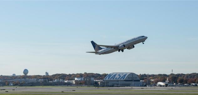 united plane flying over the nasa building at cleveland hopkins international airport