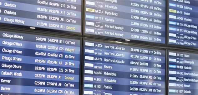 flight status screens at the airport