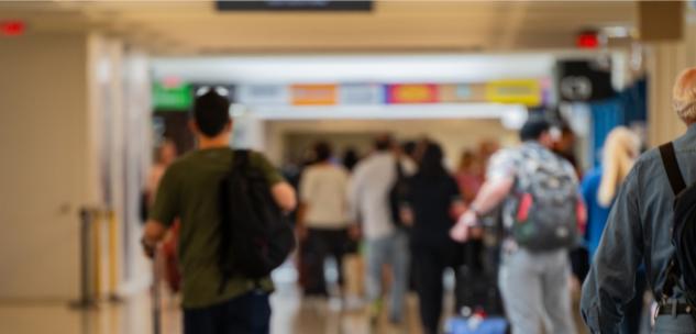 people walking in the terminals at the airport