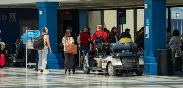 people lined up to board their flight